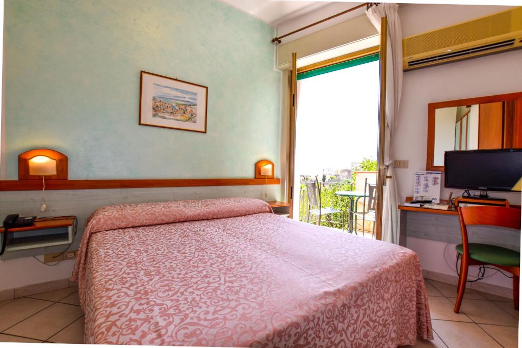 Postel nebo postele na pokoji v ubytování Hotel Condor