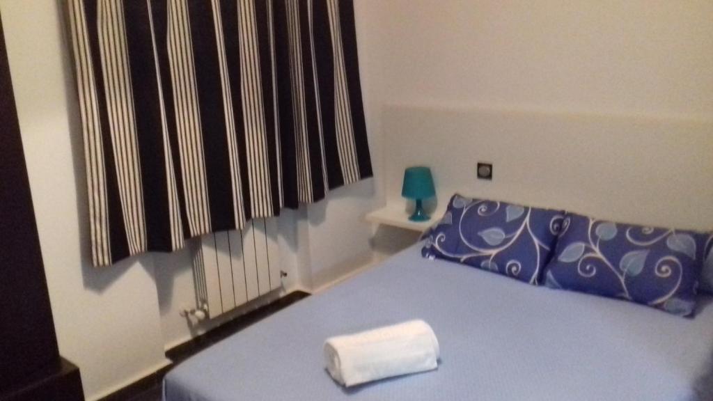 Postel nebo postele na pokoji v ubytování Apartamentos Turísticos Los Ángeles