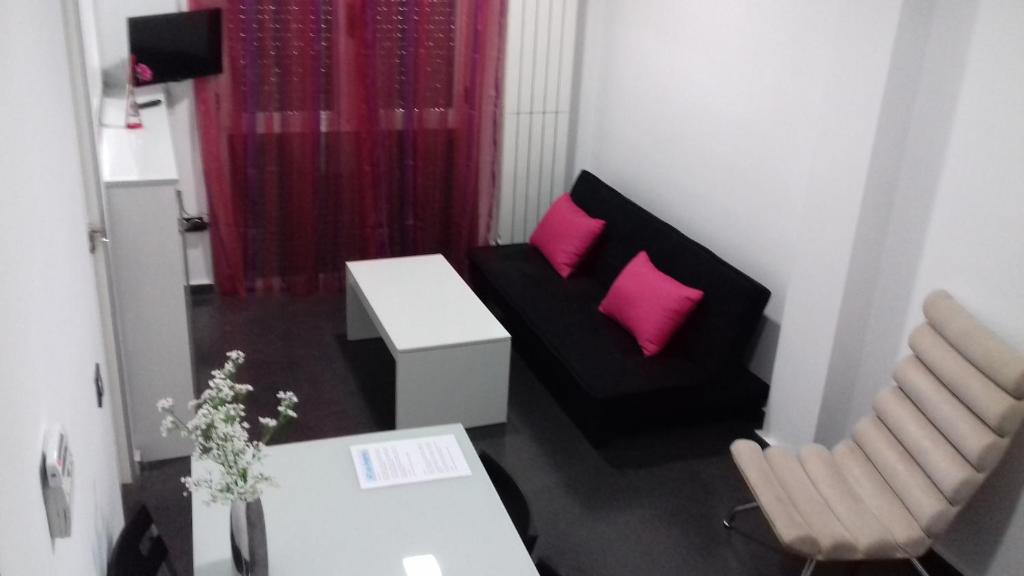 TV a/nebo společenská místnost v ubytování Apartamentos Turísticos Los Ángeles