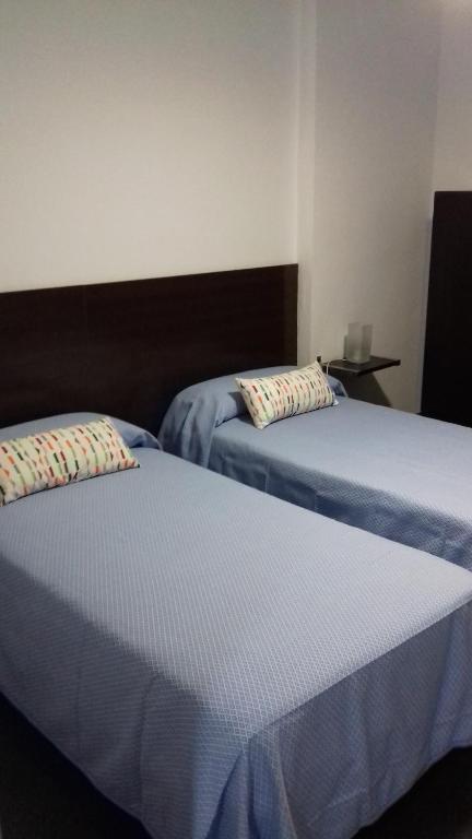 Postel nebo postele na pokoji v ubytování Apartamentos Turísticos Los Ángeles