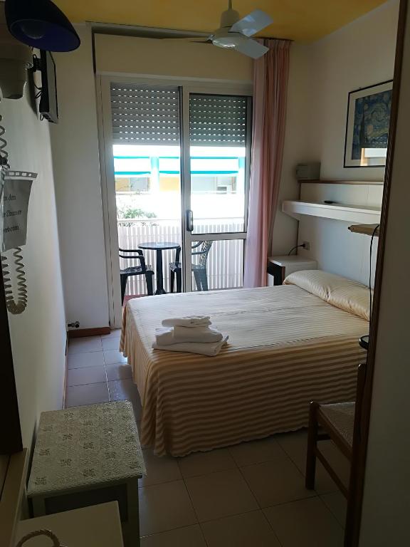 Postel nebo postele na pokoji v ubytování Hotel Paron