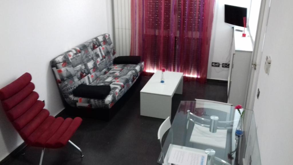 TV a/nebo společenská místnost v ubytování Apartamentos Turísticos Los Ángeles