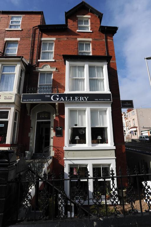 a red brick building with a sign on it at The Gallery in Blackpool