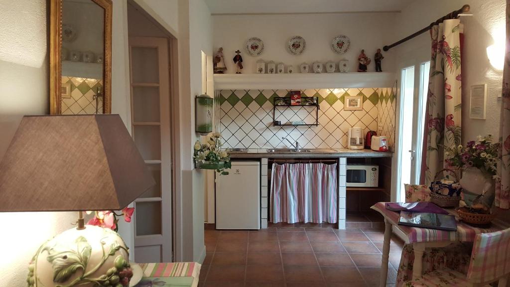 Kuchyň nebo kuchyňský kout v ubytování Résidence Le Home