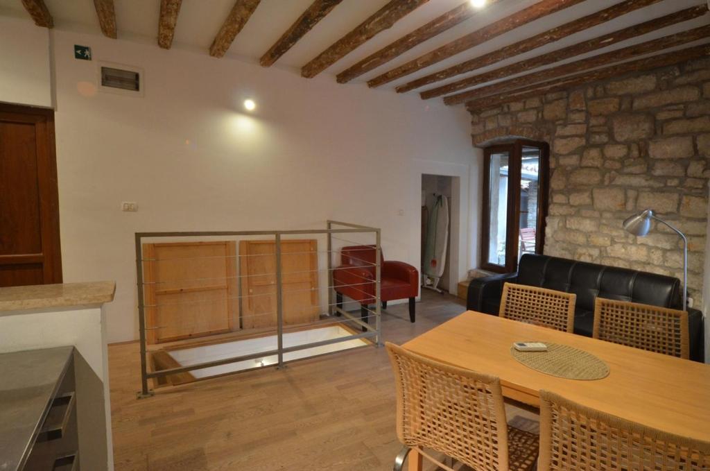Posedenie v ubytovaní Apartment Il Cortile with garden and parking