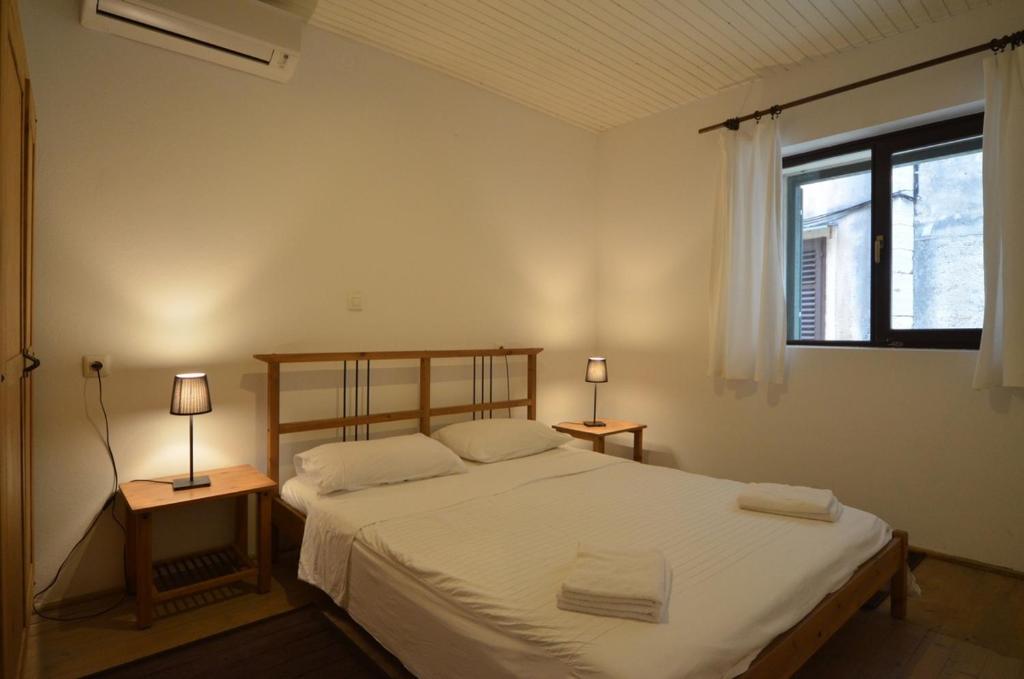 Posteľ alebo postele v izbe v ubytovaní Apartment Il Cortile with garden and parking