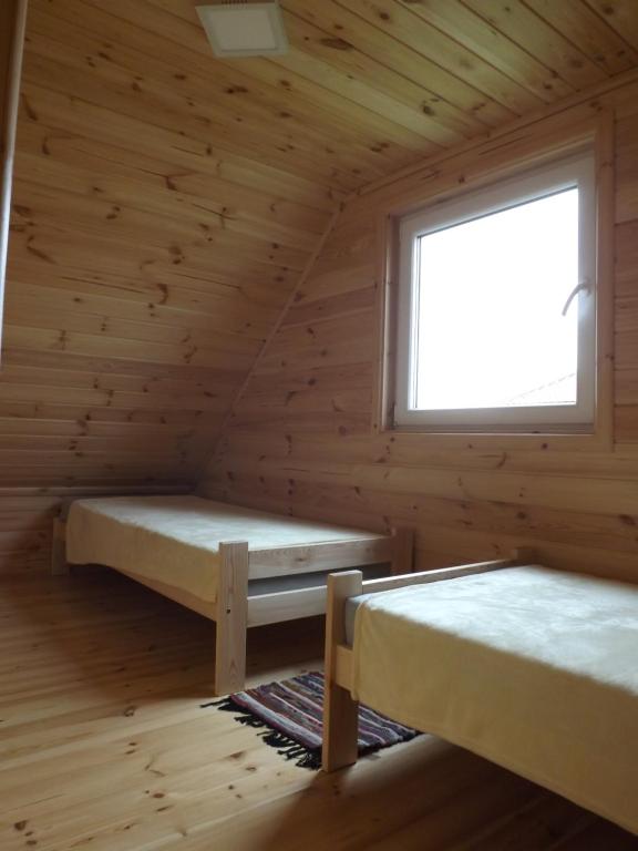 Postel nebo postele na pokoji v ubytování Domek letniskowy Orzechowa