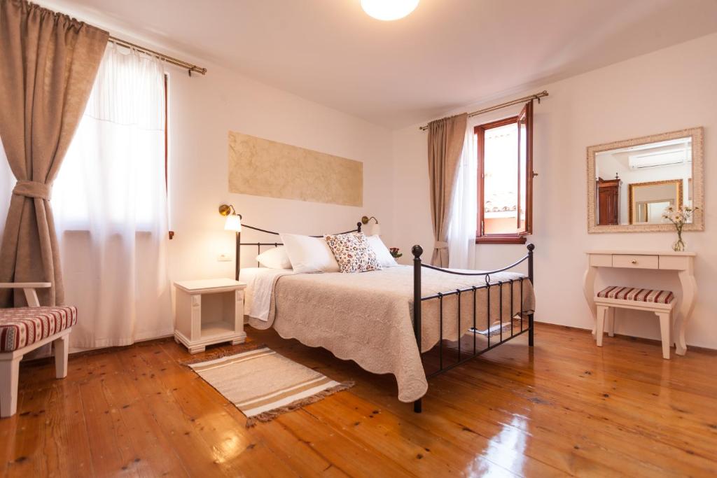 Postel nebo postele na pokoji v ubytování Guesthouse Casa Vittoria