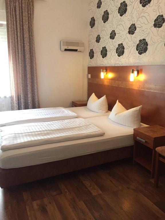 Postel nebo postele na pokoji v ubytování Hotel Monte Cristo