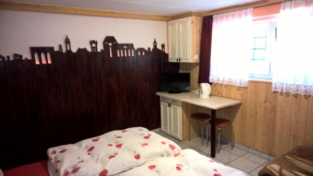 Postel nebo postele na pokoji v ubytování Apartament na Wrzosach