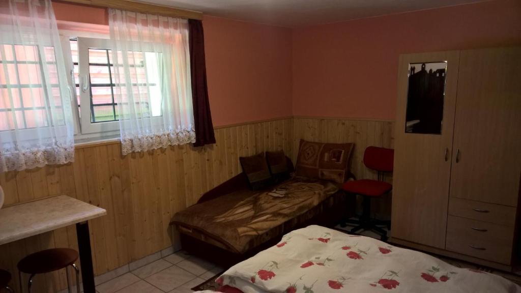 Postel nebo postele na pokoji v ubytování Apartament na Wrzosach