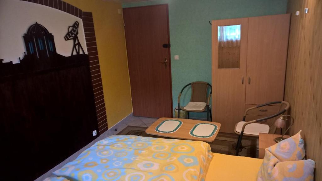 Postel nebo postele na pokoji v ubytování Apartament na Wrzosach