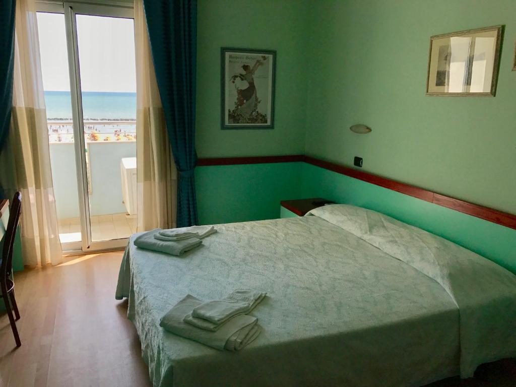 Postel nebo postele na pokoji v ubytování Hotel Mirage