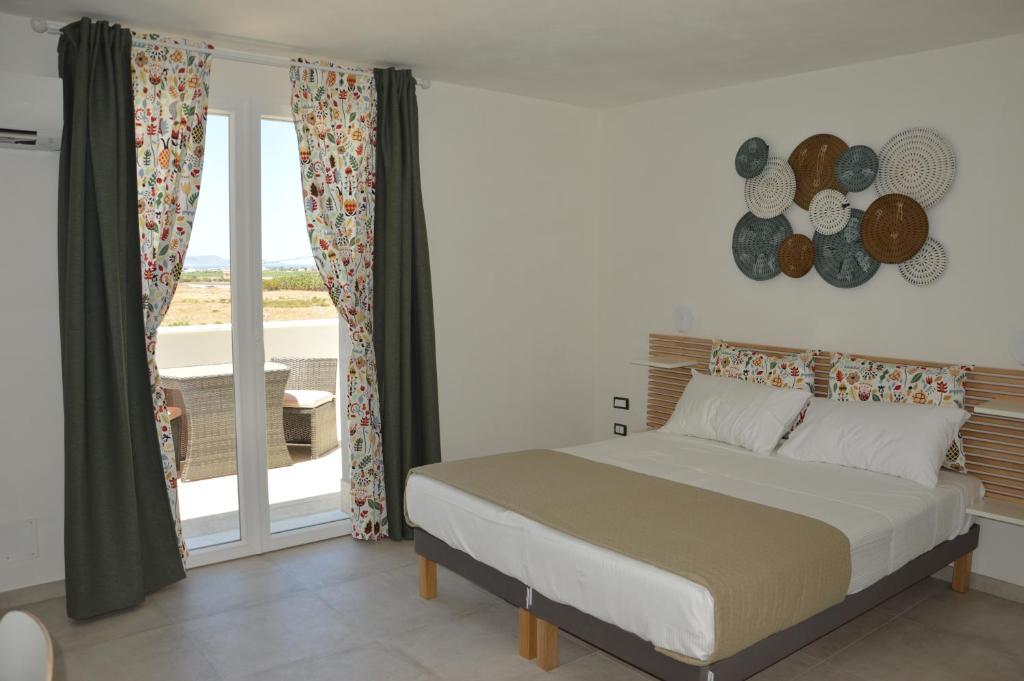 Ein Bett oder Betten in einem Zimmer der Unterkunft Colori del Mediterraneo - Trapani Airport