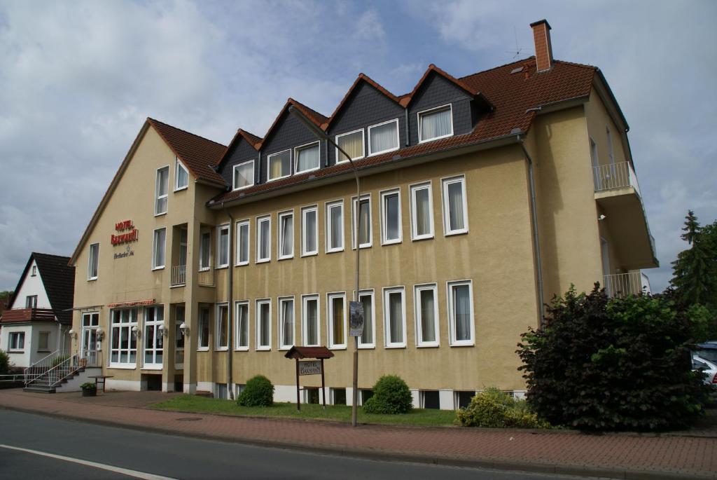 a large building on the side of a street at Weser Wasserbetten Hotel Baxmann in Hessisch Oldendorf