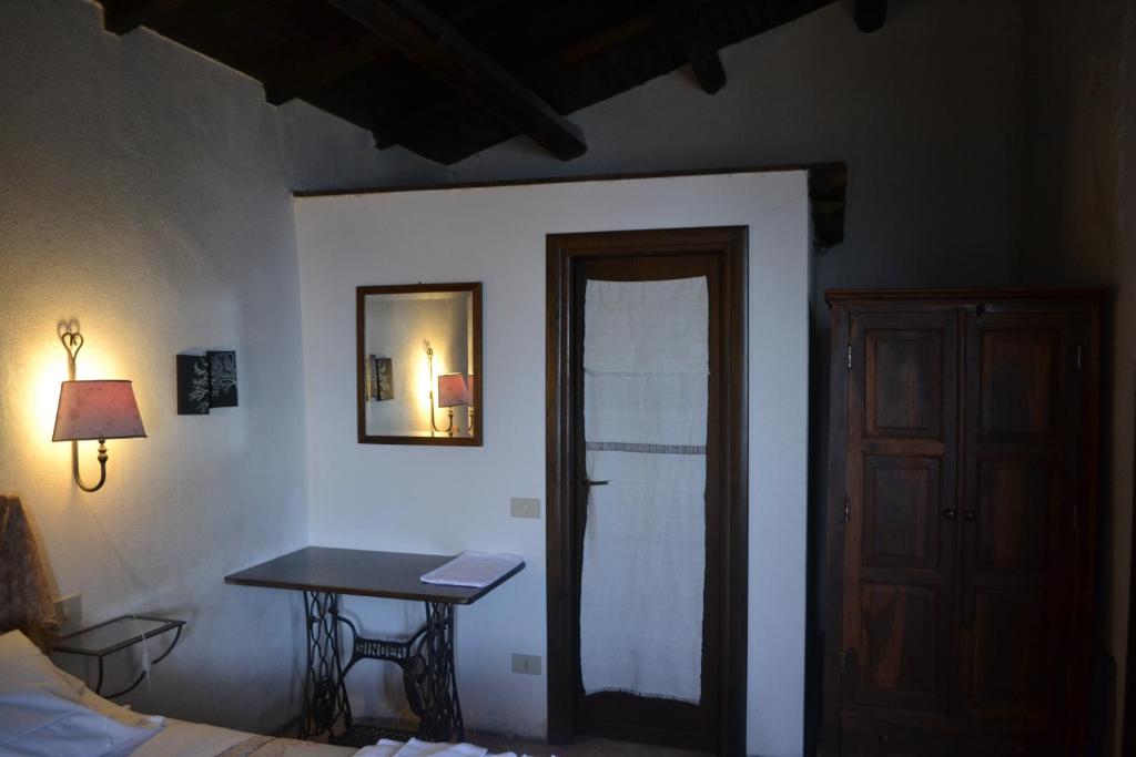 Postel nebo postele na pokoji v ubytování La Taberna di Rocca Calascio