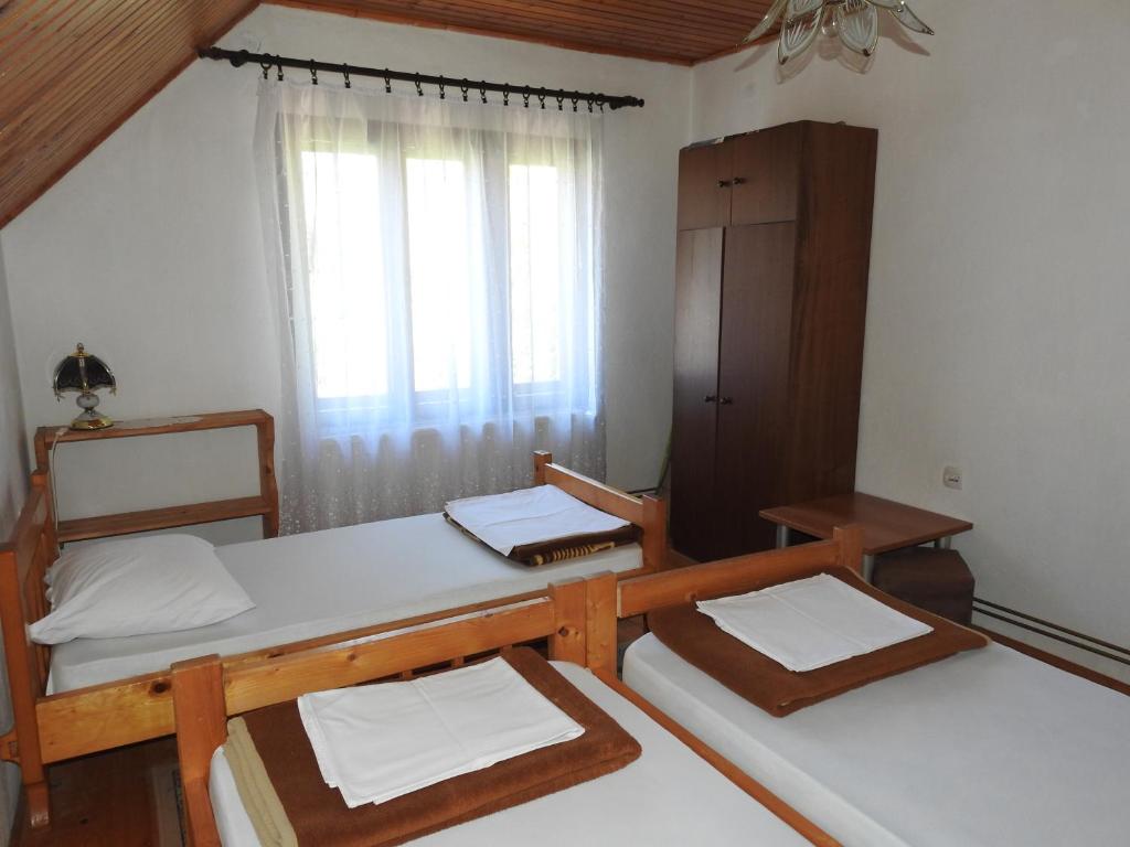 Postel nebo postele na pokoji v ubytování Apartments Vuković