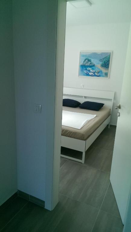 Posteľ alebo postele v izbe v ubytovaní Apartment Blue Mediteran
