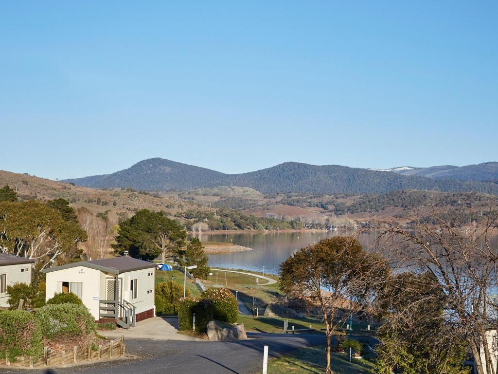 a view of a lake from a house at NRMA Jindabyne Holiday Park in Jindabyne