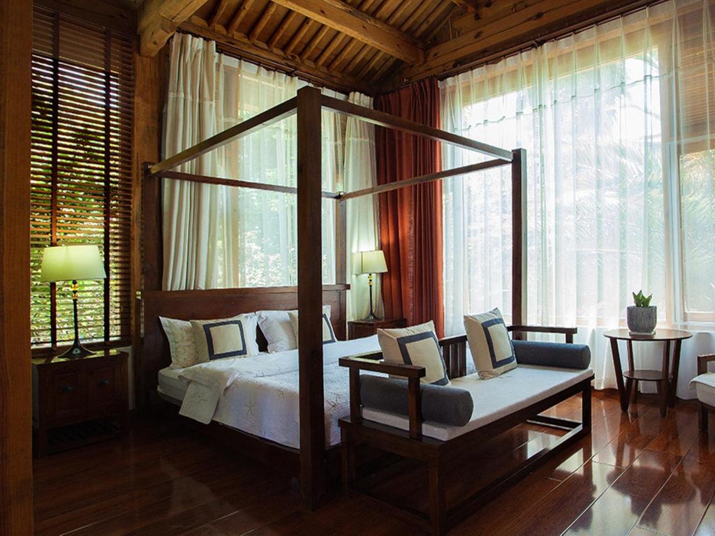 Postel nebo postele na pokoji v ubytování Dali Yunxi Boutique Inn