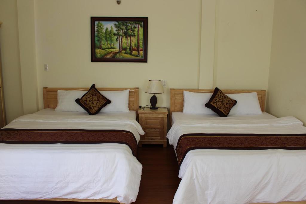 Postel nebo postele na pokoji v ubytování Thien Phu Guesthouse Dalat