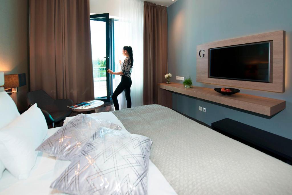 TV a/nebo společenská místnost v ubytování Grid Hotel