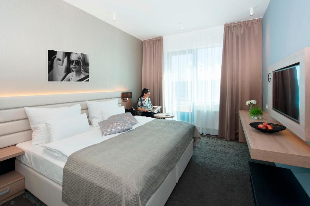 Postel nebo postele na pokoji v ubytování Grid Hotel