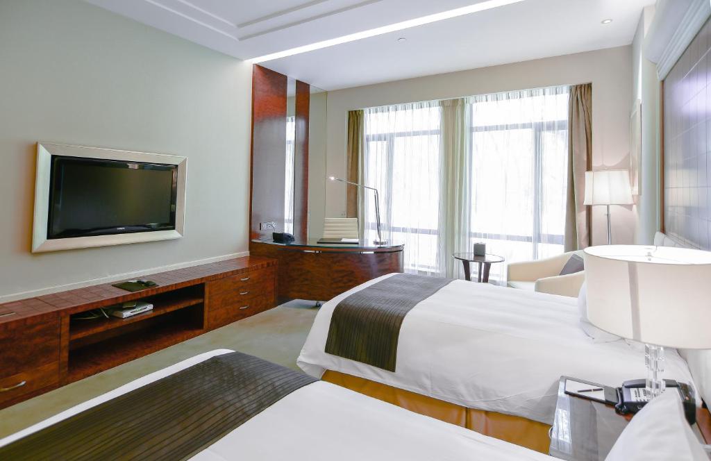 TV a/nebo společenská místnost v ubytování Xijiao State Guest Hotel