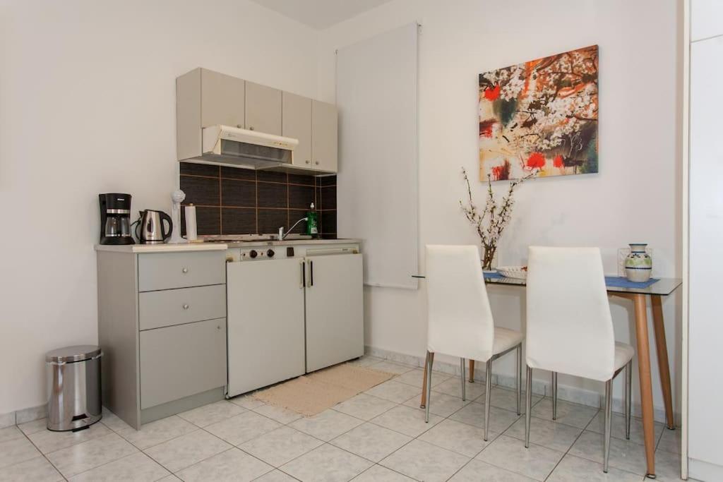 A kitchen or kitchenette at Halepa Apartments