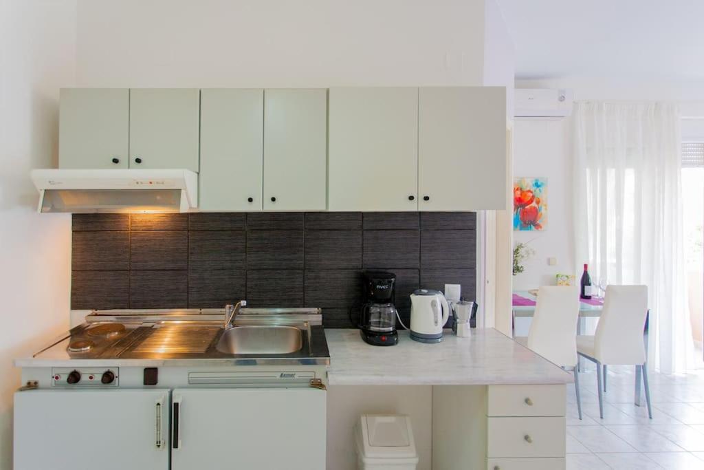 A kitchen or kitchenette at Halepa Apartments