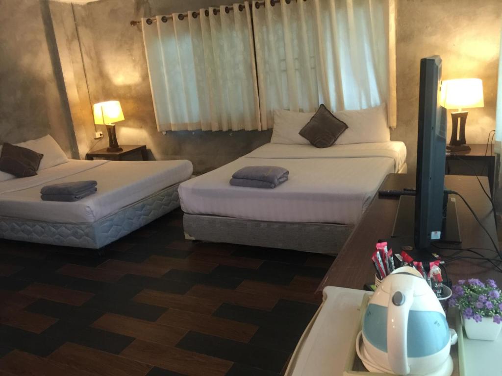 Letto o letti in una camera di Crescent Bay Resort