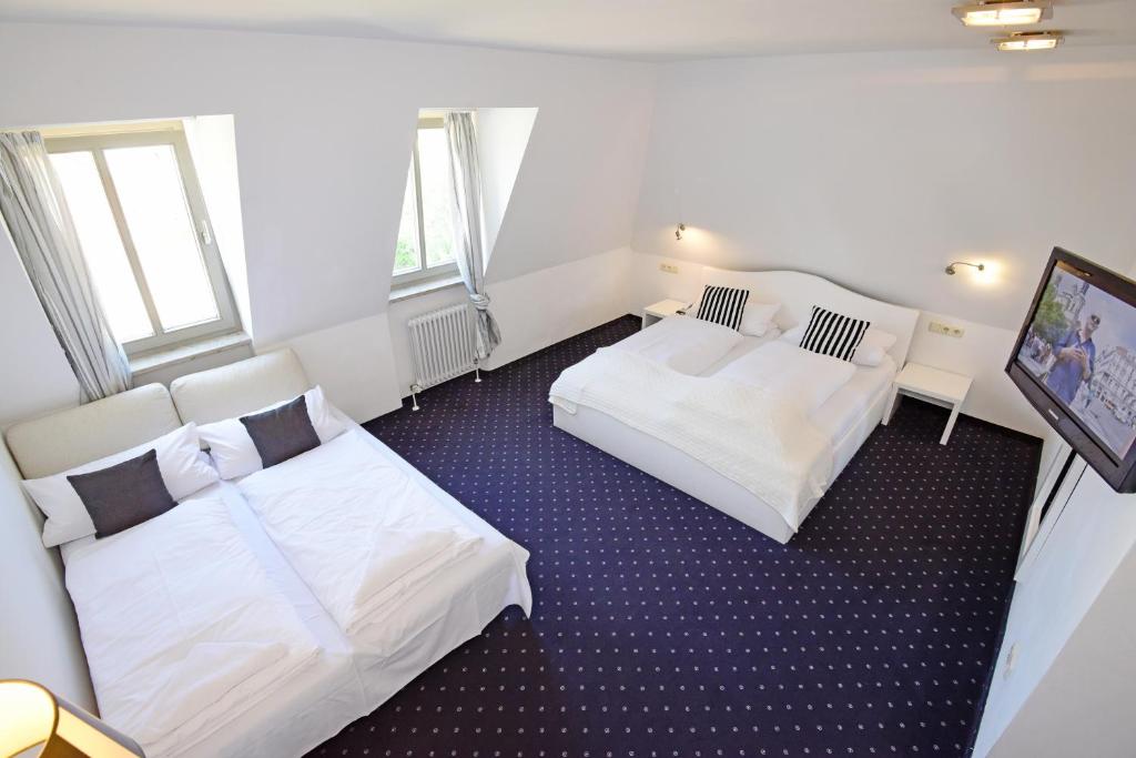 Postel nebo postele na pokoji v ubytování Hotel Domizil