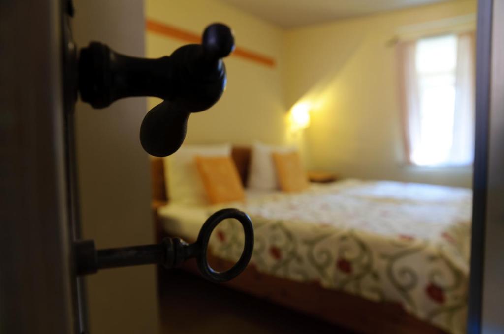 Postel nebo postele na pokoji v ubytování Hotel am Hoken