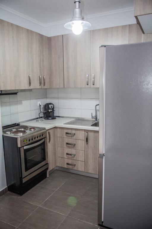 Kuchyň nebo kuchyňský kout v ubytování Sea view appartment in Geoponika