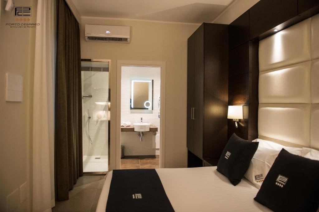 Postel nebo postele na pokoji v ubytování Porto Cesareo Exclusive Room