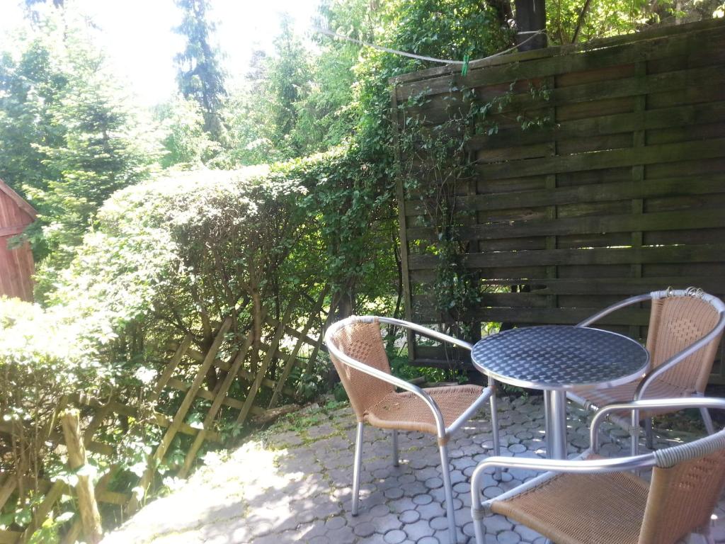 a table and chairs sitting on a patio at Chata Baryła in Sulęczyno