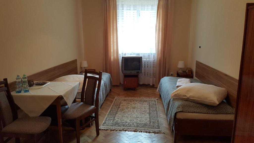 Posteľ alebo postele v izbe v ubytovaní Stary Dom Zdrojowy