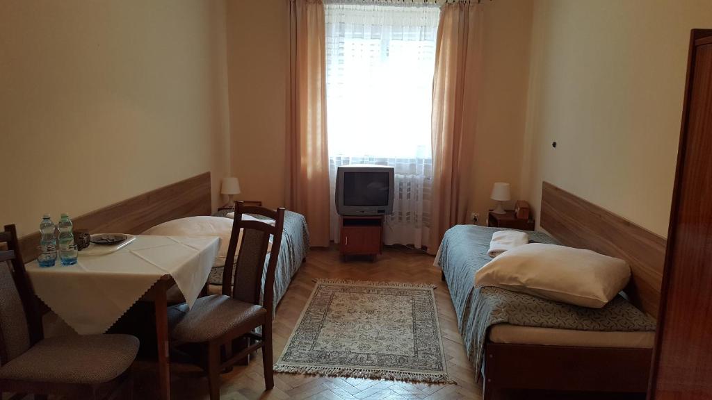 Posteľ alebo postele v izbe v ubytovaní Stary Dom Zdrojowy