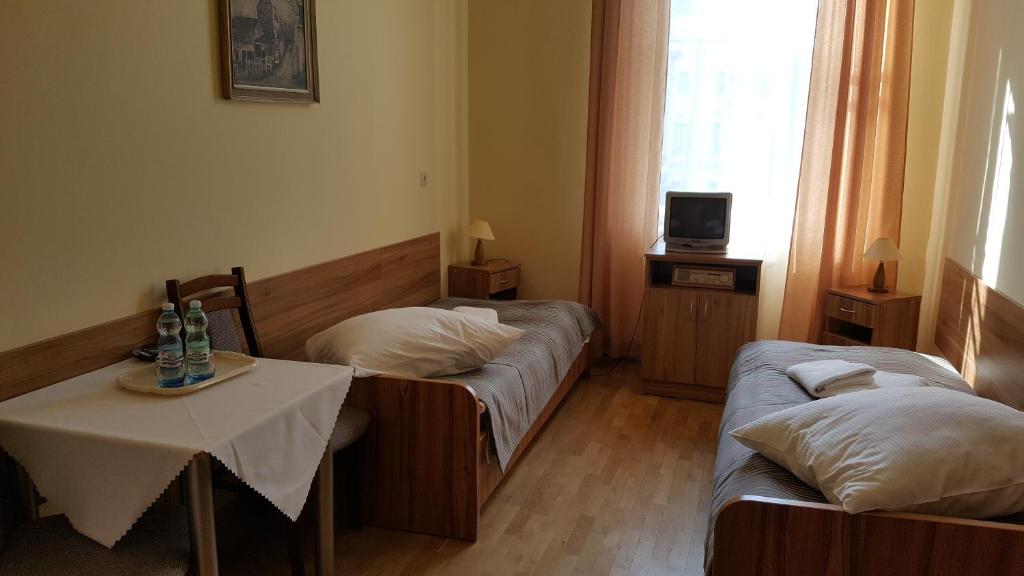 Posteľ alebo postele v izbe v ubytovaní Stary Dom Zdrojowy