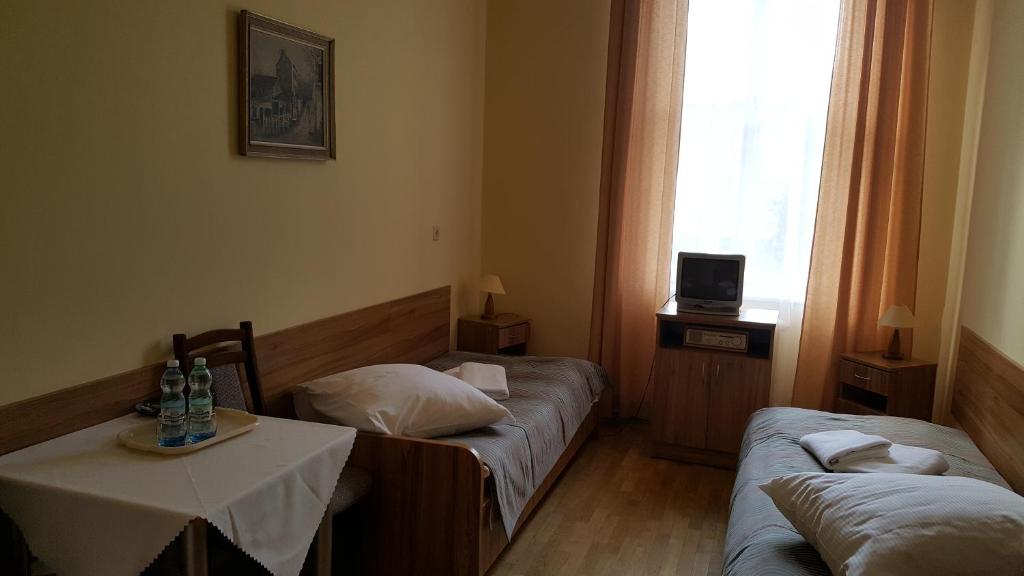 Posteľ alebo postele v izbe v ubytovaní Stary Dom Zdrojowy