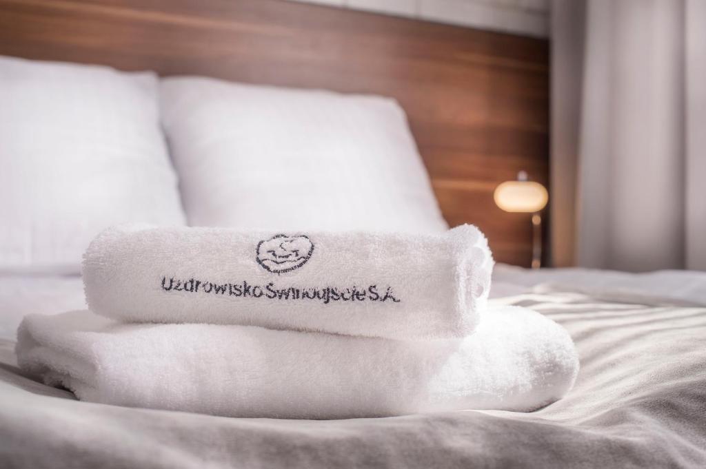 Postel nebo postele na pokoji v ubytování Admirał I