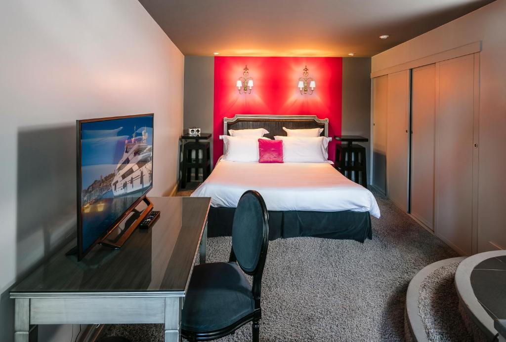 Un pat sau paturi într-o cameră la Villa Garbo