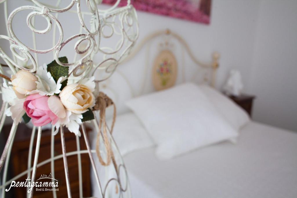 A bed or beds in a room at Il Pentagramma