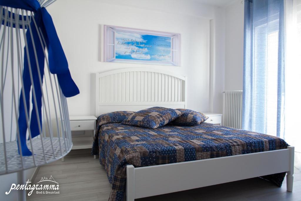 A bed or beds in a room at Il Pentagramma