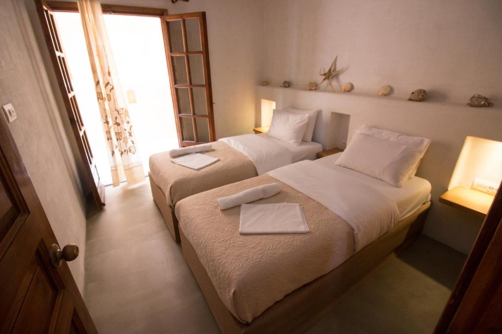 Postel nebo postele na pokoji v ubytování Ilias Apartments