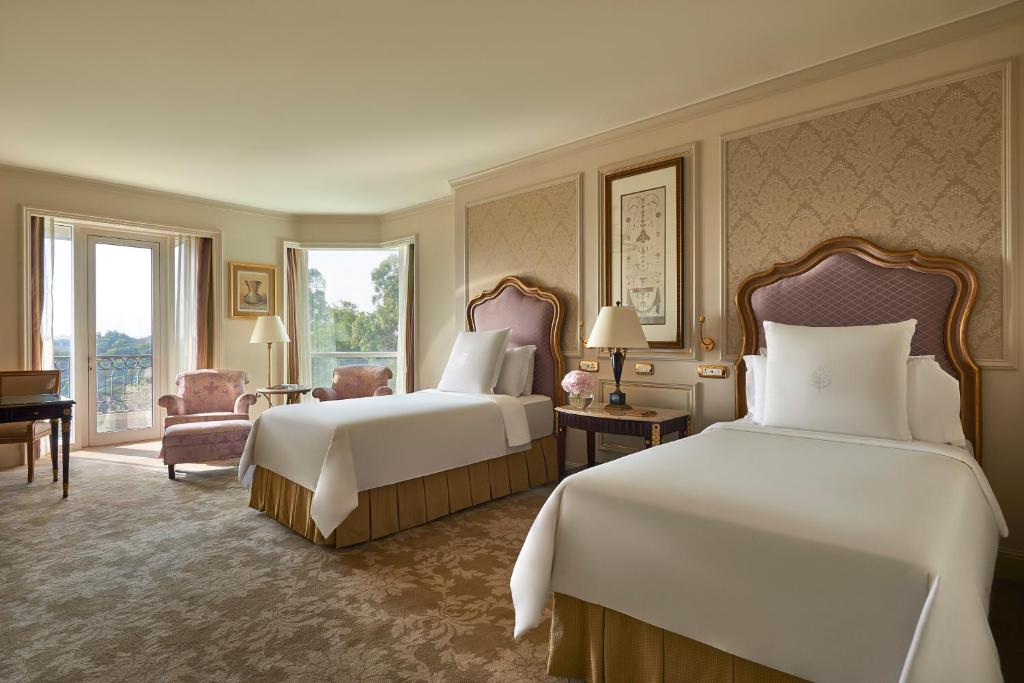 Krevet ili kreveti u jedinici u okviru objekta Four Seasons Cairo At The First Residence