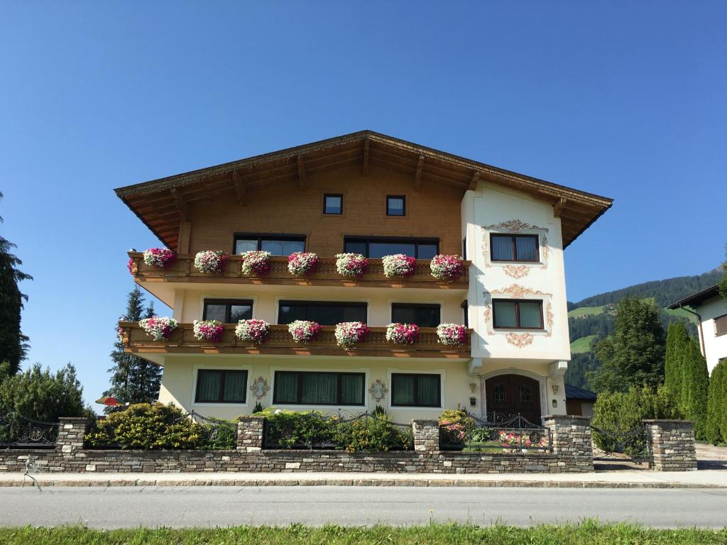 a large building with flower boxes on it at Appartements Michaela in Westendorf