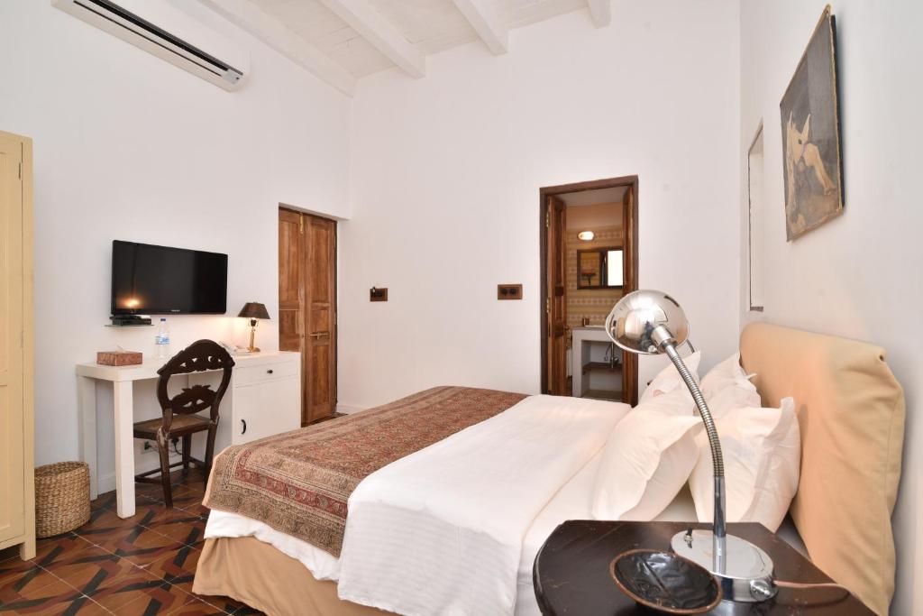TV a/nebo společenská místnost v ubytování Mateus Boutique Hotel
