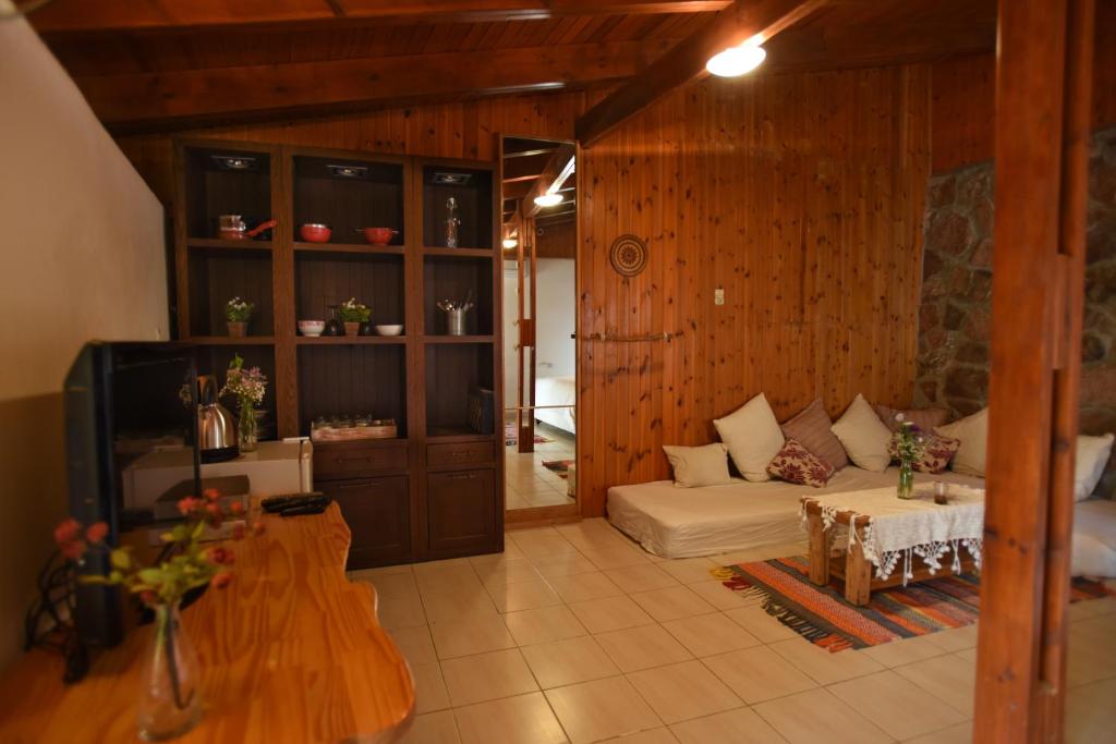 a living room with a couch and a table at Williams House in Eilat