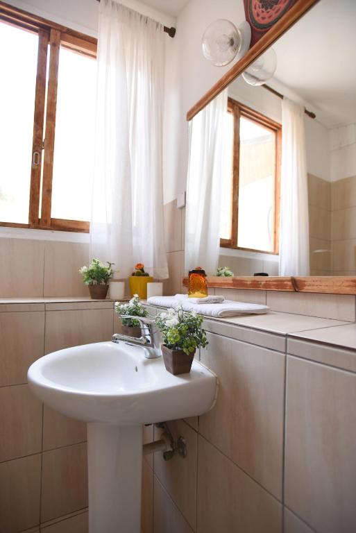 a bathroom with a sink and a mirror at Williams House in Eilat